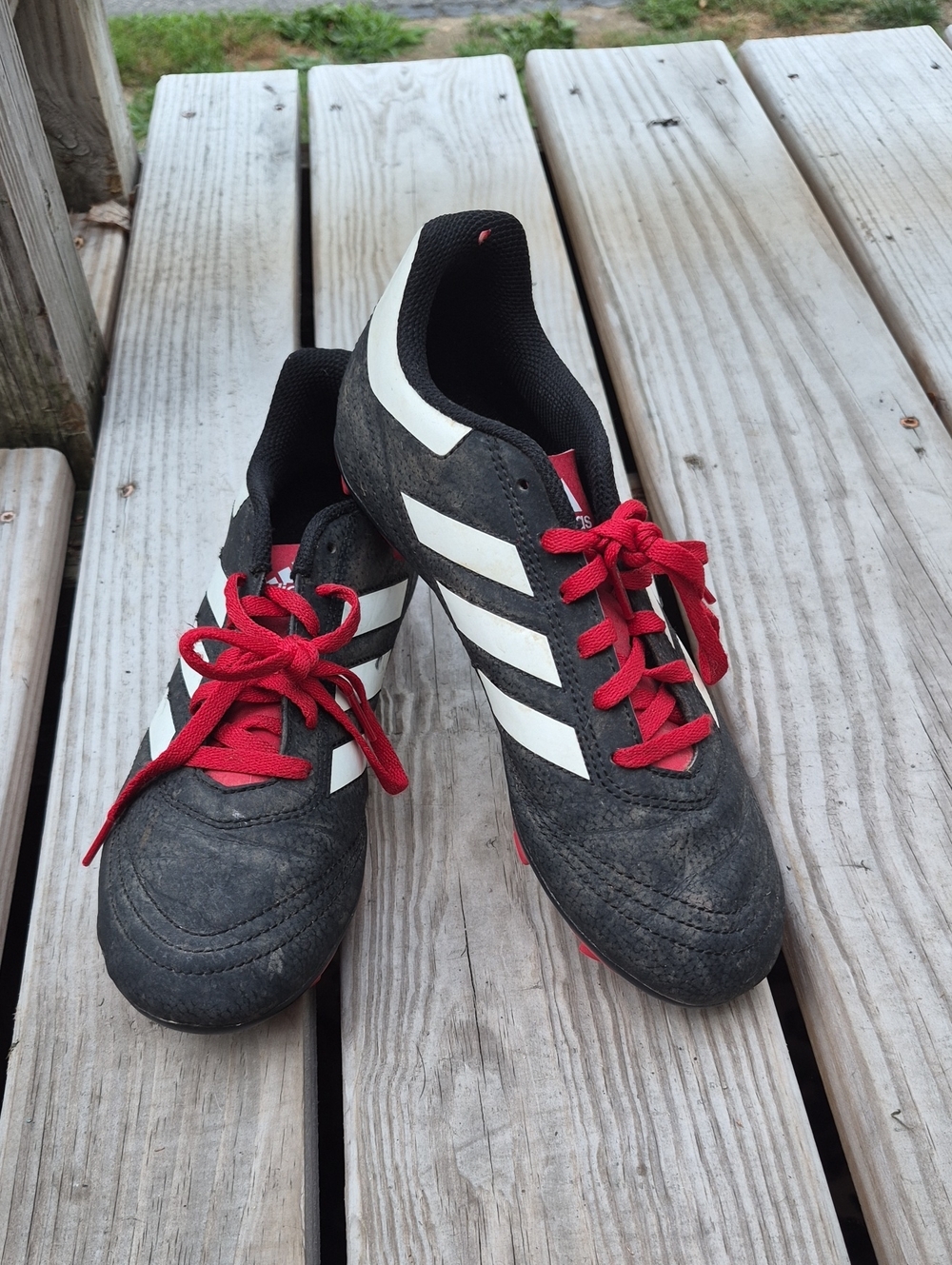 adidas Black Soccer Shoes with White Stripes and Red Laces